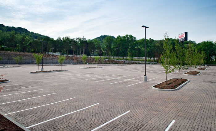Interlocking concrete paver parking lot with spaces for trees.